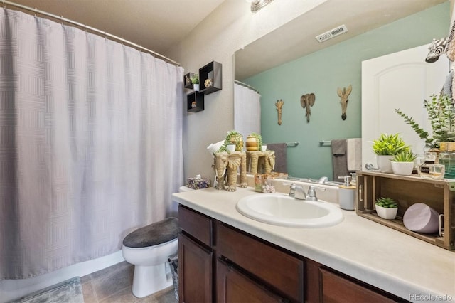 full bath featuring toilet, tile patterned floors, vanity, visible vents, and a shower with curtain