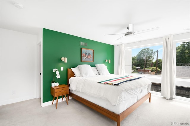 2242 W 34th Ave, Denver, CO 80211 - bedroom with light carpet, baseboards, and a ceiling fan