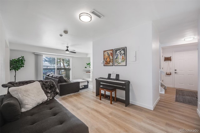 6435 S Dayton St Unit 103, Englewood, CO 80111 - living room featuring visible vents, light wood finished floors, baseboards, and ceiling fan