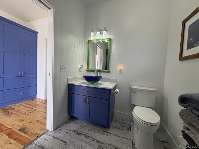 601 N Wood St, Silver Cliff, CO 81252 - bathroom with baseboards, toilet, and vanity