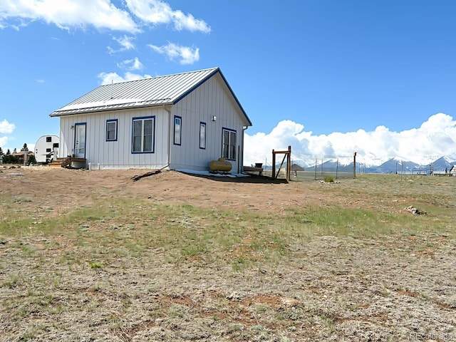 601 N Wood St, Silver Cliff, CO 81252 - view of home's exterior with a standing seam roof, board and batten siding, and metal roof