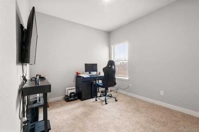 office space with carpet and baseboards