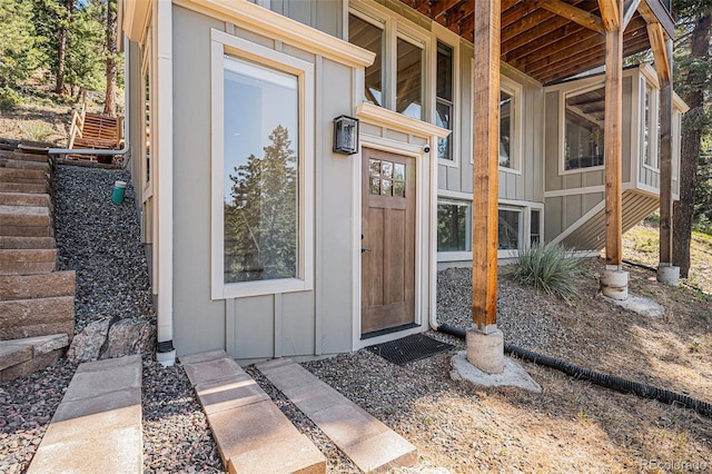 32783 Lodgepole Cir, Evergreen, CO 80439 - view of exterior entry featuring board and batten siding