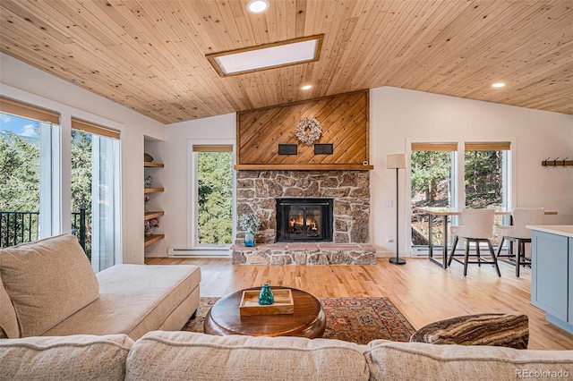32783 Lodgepole Cir, Evergreen, CO 80439 - living area featuring lofted ceiling, wood ceiling, a skylight, recessed lighting, and plenty of natural light