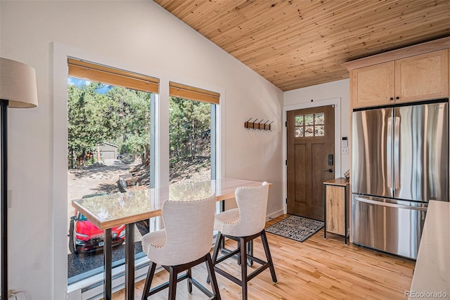 32783 Lodgepole Cir, Evergreen, CO 80439 - dining area featuring lofted ceiling, light wood-type flooring, a baseboard radiator, and wooden ceiling