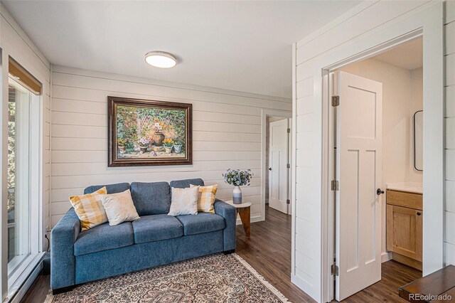 32783 Lodgepole Cir, Evergreen, CO 80439 - living area featuring dark wood-style floors and wood walls