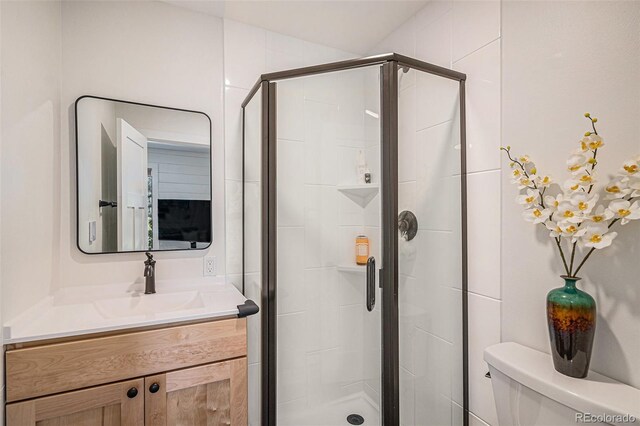 32783 Lodgepole Cir, Evergreen, CO 80439 - bathroom featuring vanity and a shower stall