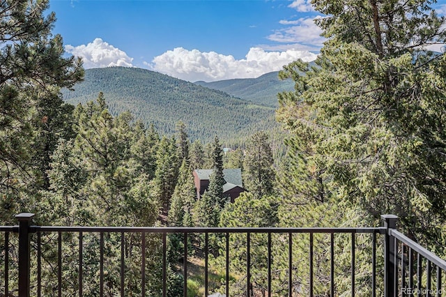 32783 Lodgepole Cir, Evergreen, CO 80439 - view of mountain backdrop featuring a heavily wooded area