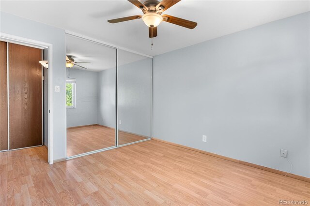 17503 E Lasalle Dr, Aurora, CO 80013 - unfurnished bedroom with light wood-style floors, a closet, and a ceiling fan