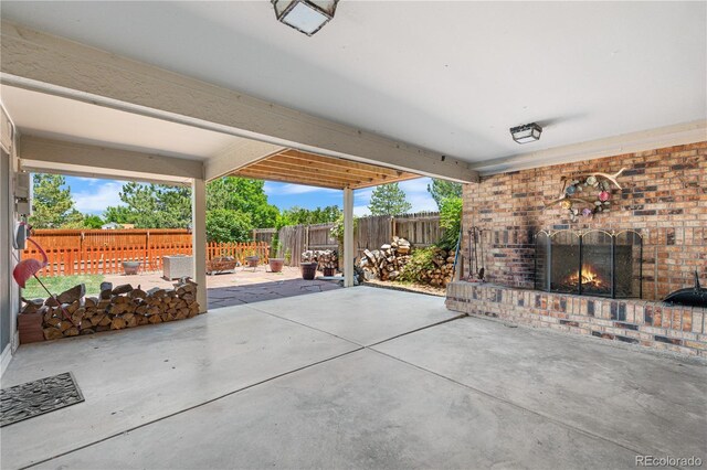 17503 E Lasalle Dr, Aurora, CO 80013 - fenced backyard featuring an outdoor brick fireplace and a patio area