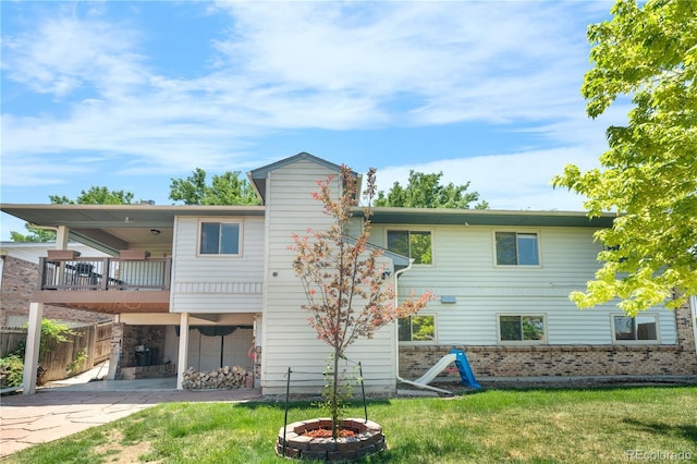 17503 E Lasalle Dr, Aurora, CO 80013 - rear view of house with a balcony and brick siding