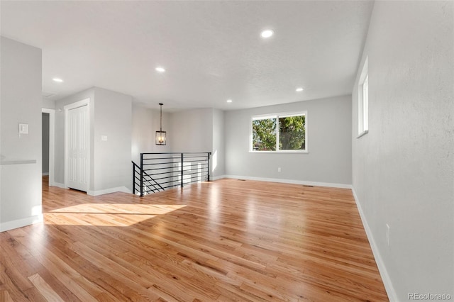 spare room with light hardwood / wood-style flooring