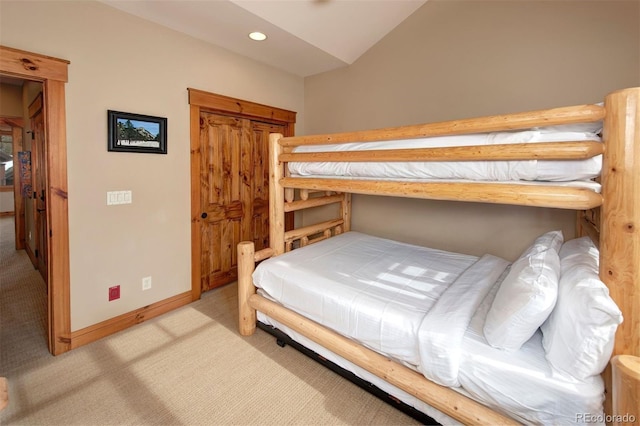 bedroom featuring recessed lighting, light colored carpet, vaulted ceiling, and baseboards