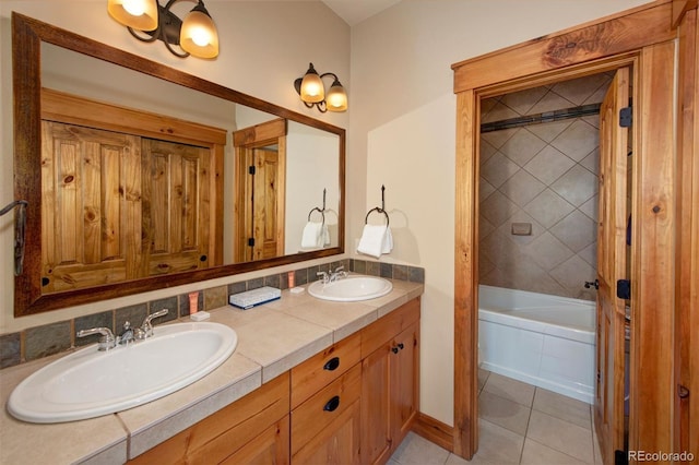 full bathroom with double vanity, tile patterned flooring, a sink, and bathing tub / shower combination