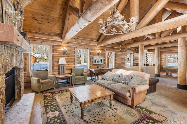 living area featuring billiards, wooden ceiling, stone tile flooring, a stone fireplace, and beam ceiling