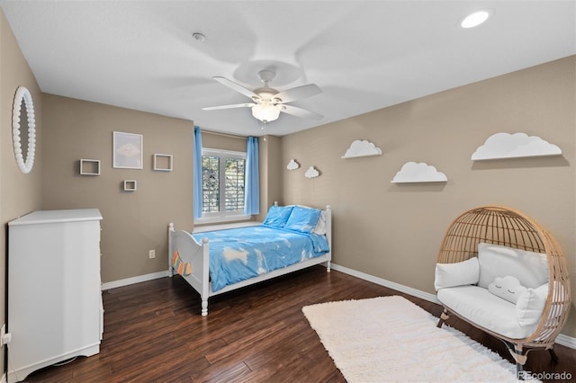 bedroom featuring dark hardwood / wood-style flooring and ceiling fan