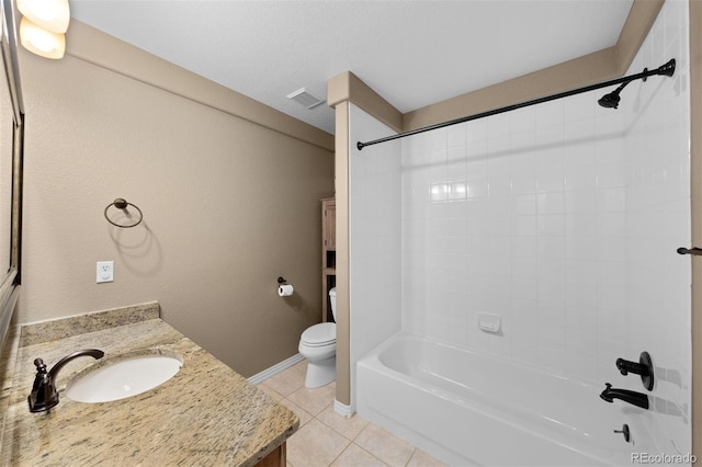 full bathroom featuring vanity, tiled shower / bath combo, tile patterned floors, and toilet