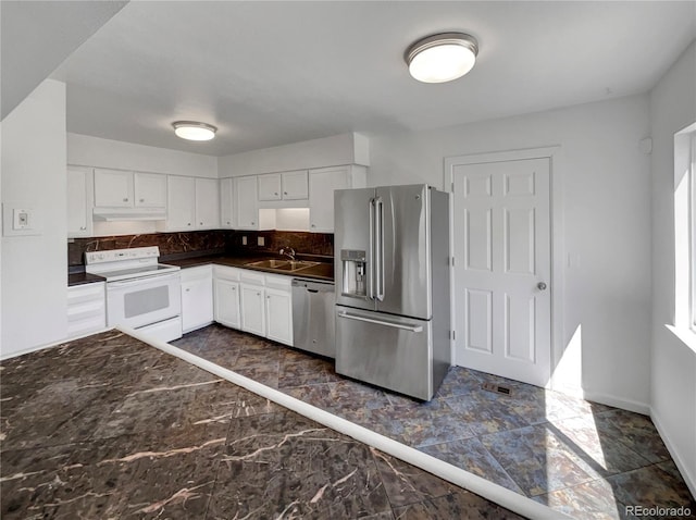 4416 S Vivian St, Morrison, CO 80465 - kitchen featuring stainless steel appliances, dark marble finish floors, dark countertops, white cabinets, and backsplash