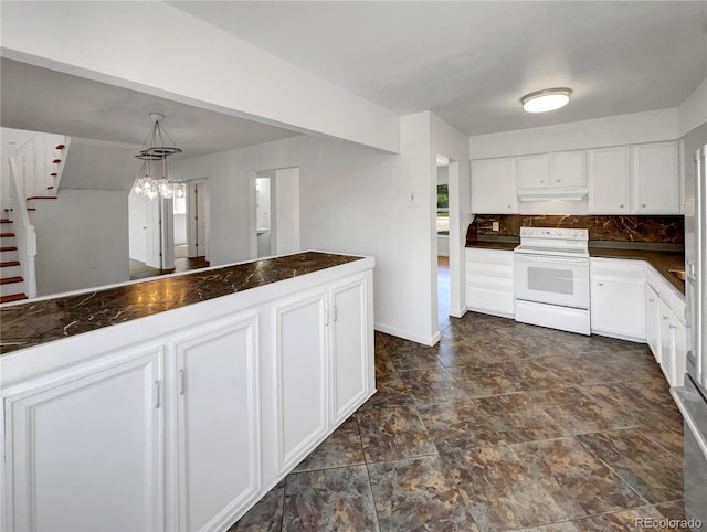4416 S Vivian St, Morrison, CO 80465 - kitchen with electric range, dark countertops, white cabinetry, under cabinet range hood, and backsplash
