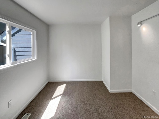 4416 S Vivian St, Morrison, CO 80465 - carpeted empty room featuring baseboards