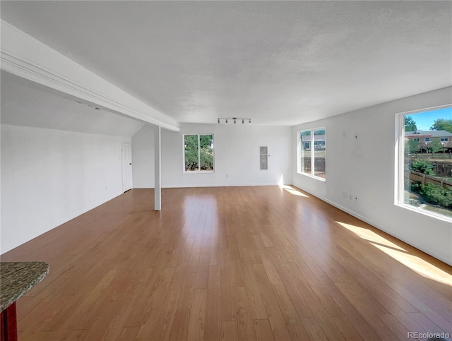 4416 S Vivian St, Morrison, CO 80465 - unfurnished living room featuring hardwood / wood-style flooring and baseboards