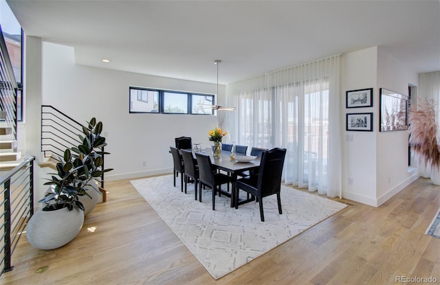 4224 E Dickenson Pl, Denver, CO 80222 - dining space featuring stairway, light wood-style floors, and recessed lighting