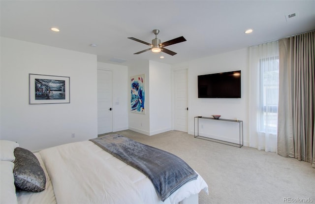 bedroom featuring light carpet and ceiling fan