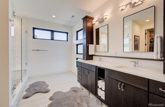 4224 E Dickenson Pl, Denver, CO 80222 - full bath featuring a stall shower, double vanity, a walk in closet, and recessed lighting