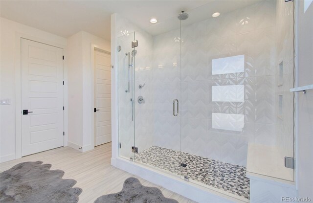 4224 E Dickenson Pl, Denver, CO 80222 - bathroom with a shower stall, wood finished floors, and recessed lighting