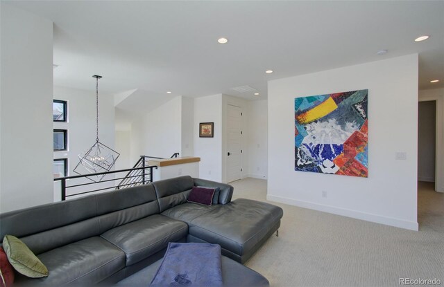 4224 E Dickenson Pl, Denver, CO 80222 - living room featuring recessed lighting, light colored carpet, and a chandelier