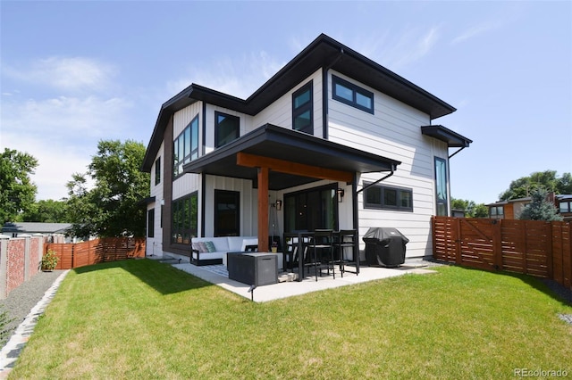 4224 E Dickenson Pl, Denver, CO 80222 - rear view of property featuring a fenced backyard, a patio area, and outdoor lounge area