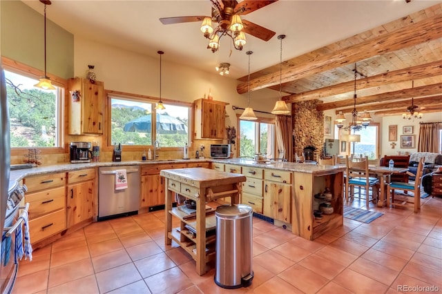 kitchen with ceiling fan, pendant lighting, stainless steel appliances, and a center island