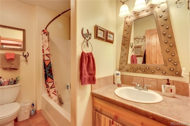 full bathroom featuring vanity, tile patterned flooring, tasteful backsplash, shower / tub combo, and toilet