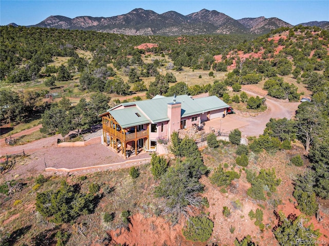 birds eye view of property featuring a mountain view