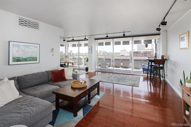 790 N Washington St Unit 1210, Denver, CO 80203 - living room with rail lighting, wood finished floors, and a city view