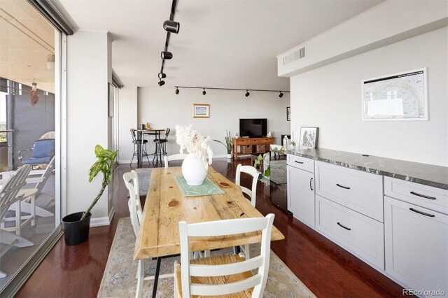 790 N Washington St Unit 1210, Denver, CO 80203 - dining room featuring rail lighting and dark wood-style floors
