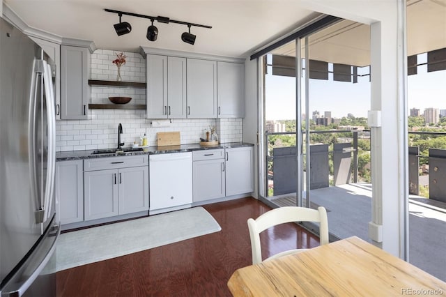 790 N Washington St Unit 1210, Denver, CO 80203 - kitchen featuring freestanding refrigerator, white dishwasher, open shelves, tasteful backsplash, and dark wood-style floors