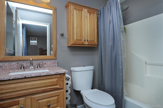 full bathroom with vanity, toilet, and shower / bathtub combination with curtain