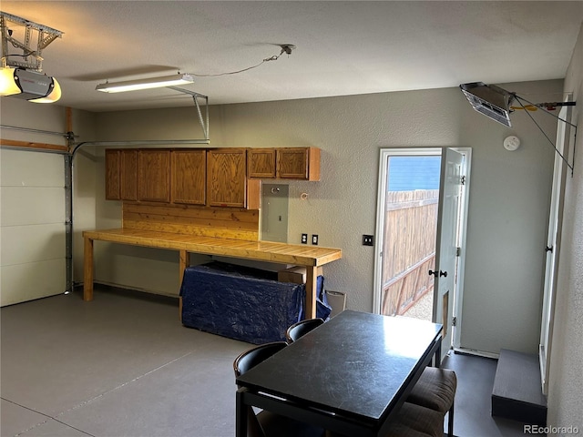 interior space featuring a garage door opener and electric panel