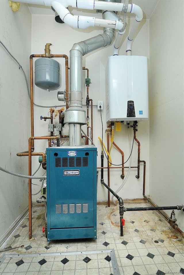 utility room featuring tankless water heater