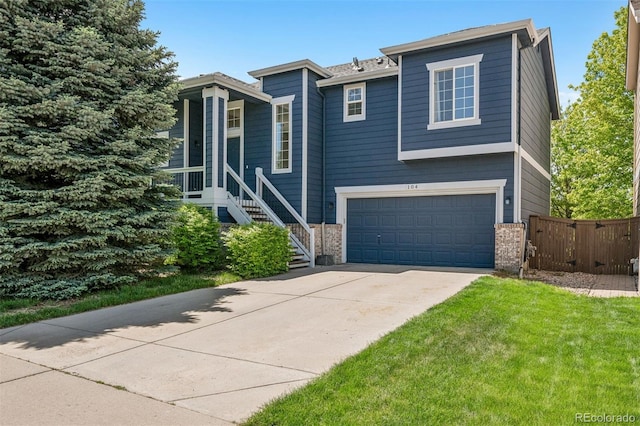 104 Willowick Cir, Highlands Ranch, CO 80129 - view of front of property with concrete driveway, a garage, brick siding, and stairs