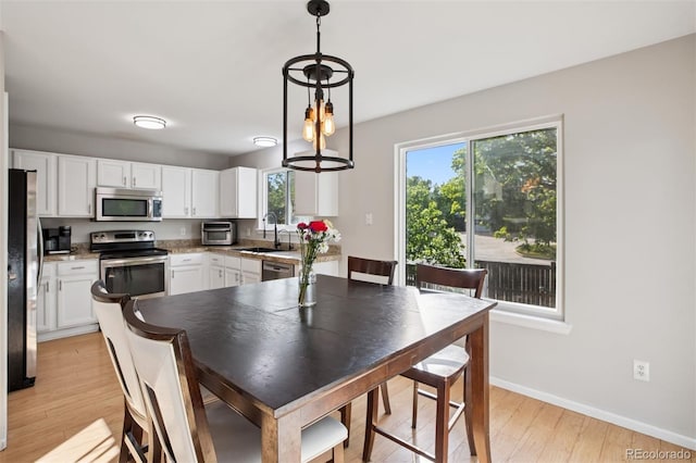 104 Willowick Cir, Highlands Ranch, CO 80129 - dining space with healthy amount of natural light and light wood-style flooring