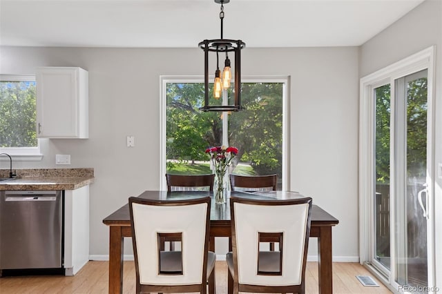 104 Willowick Cir, Highlands Ranch, CO 80129 - dining space with healthy amount of natural light and light wood finished floors