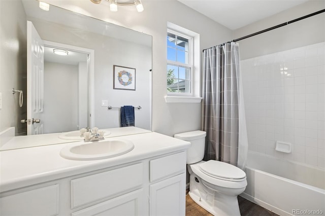 104 Willowick Cir, Highlands Ranch, CO 80129 - full bath featuring vanity, wood finished floors, and shower / bath combo with shower curtain