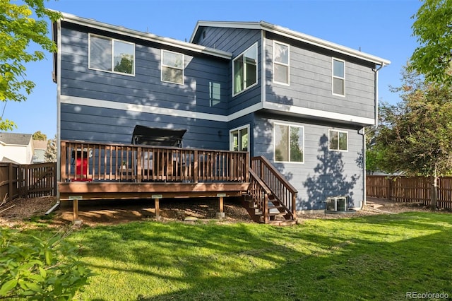 104 Willowick Cir, Highlands Ranch, CO 80129 - back of property featuring a fenced backyard and a deck