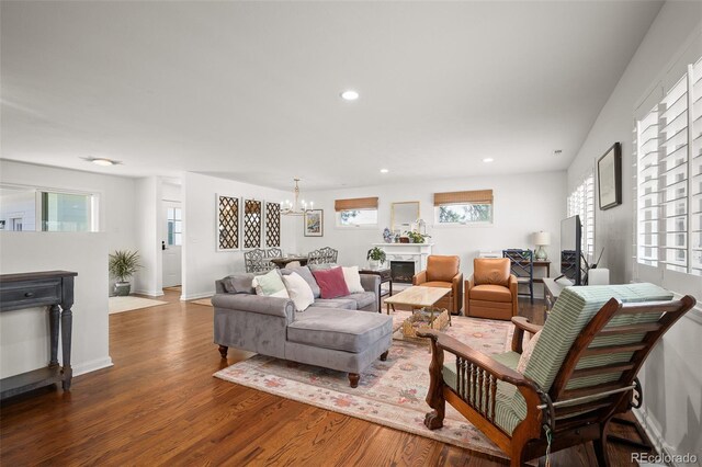 986 S Jersey St, Denver, CO 80224 - living room featuring wood finished floors, a chandelier, recessed lighting, and baseboards