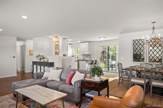 986 S Jersey St, Denver, CO 80224 - living area with a chandelier, wood finished floors, baseboards, and recessed lighting