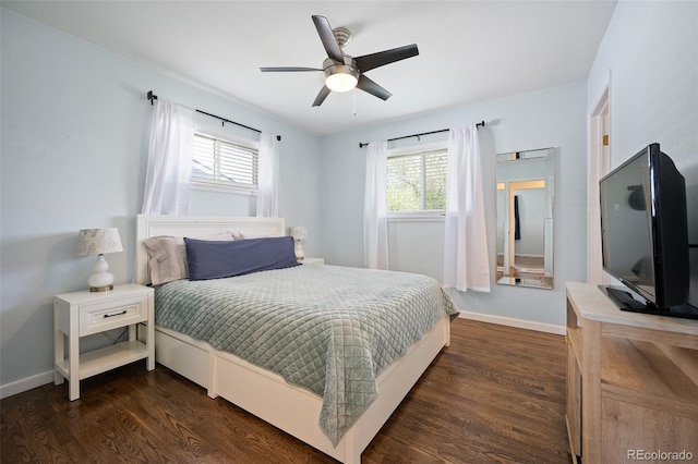 986 S Jersey St, Denver, CO 80224 - bedroom with multiple windows, dark wood-style flooring, baseboards, and a ceiling fan