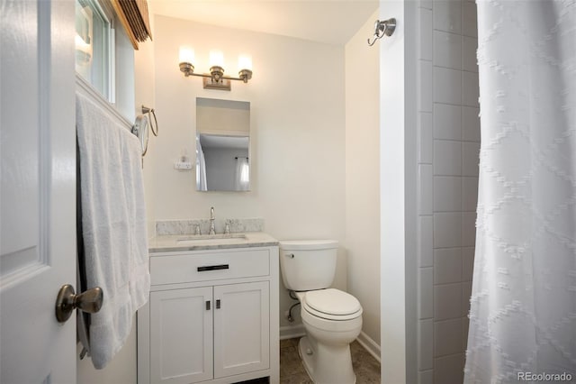 986 S Jersey St, Denver, CO 80224 - bathroom featuring vanity, toilet, a shower with curtain, and baseboards