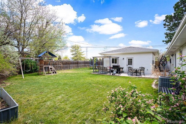 986 S Jersey St, Denver, CO 80224 - view of yard with a playground, a patio, and central air condition unit